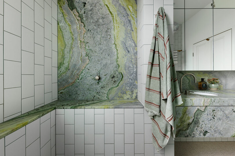 angled view of modern bathroom in green hues