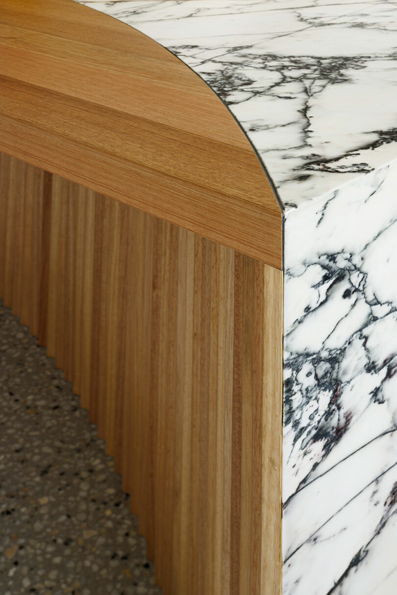 closeup shot of view of wood and marbled countertop in modern kitchen