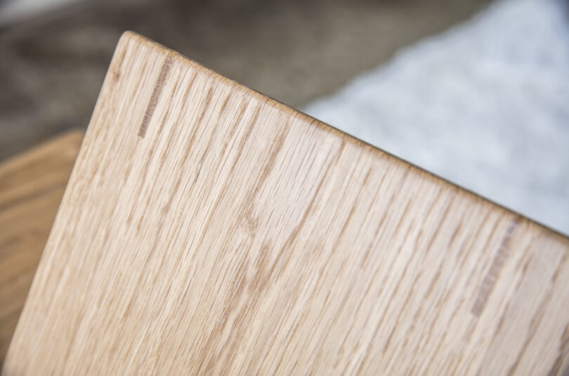 detail of triangle-shaped wooden side table