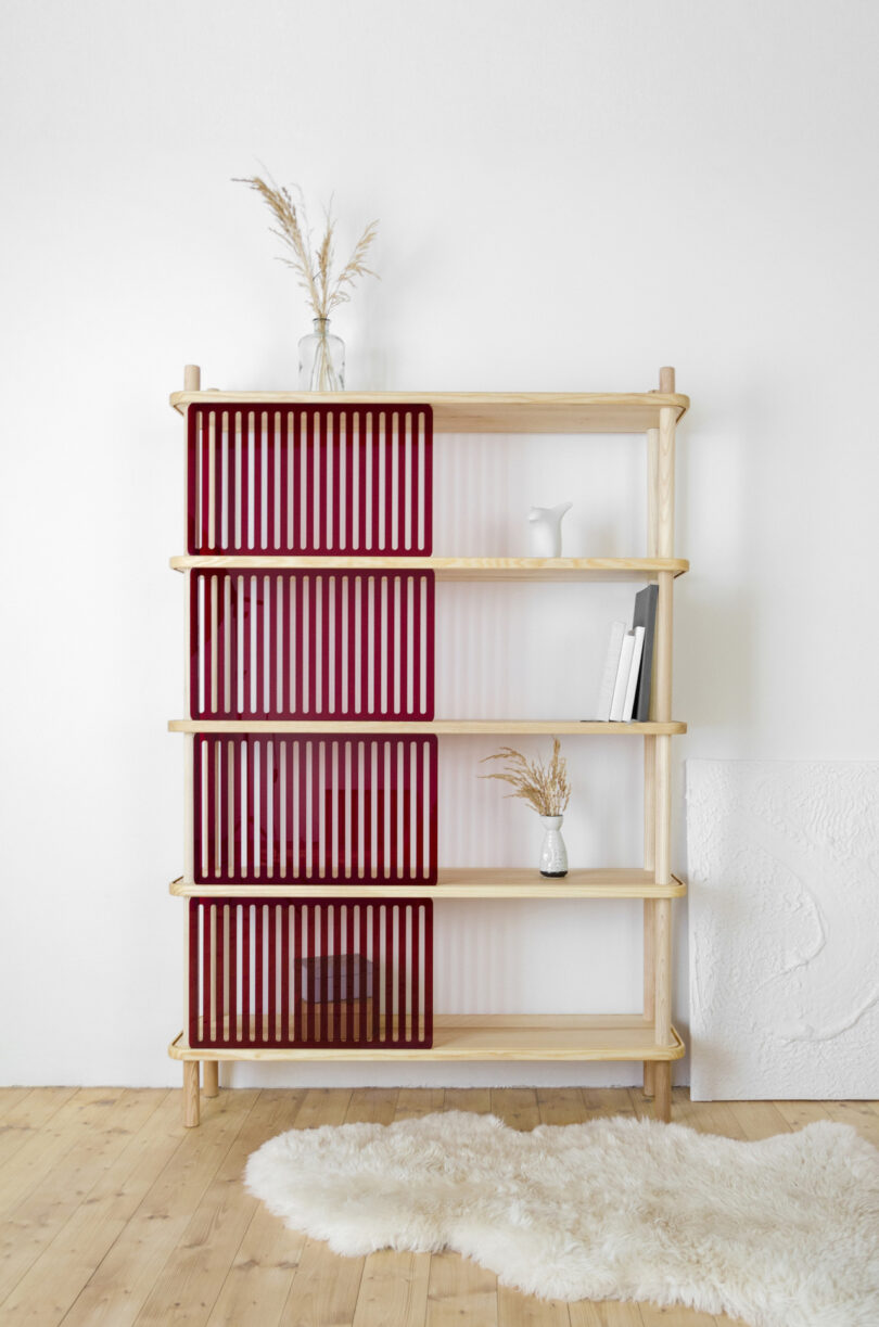 wooden shelving system with red panels