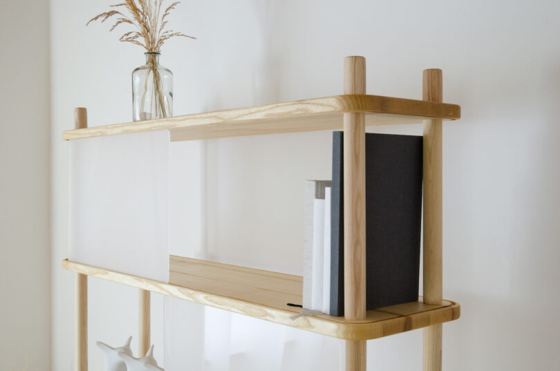 wooden shelving system with transparent panels