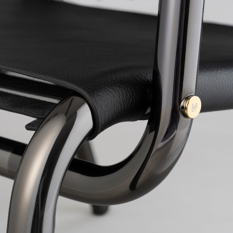 close up detail of black leather lounge chair