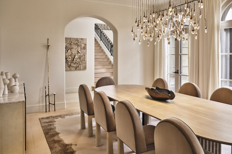 Bright and airy dining room in the Chalon Residence, featuring light-colored furnishings, neutral walls