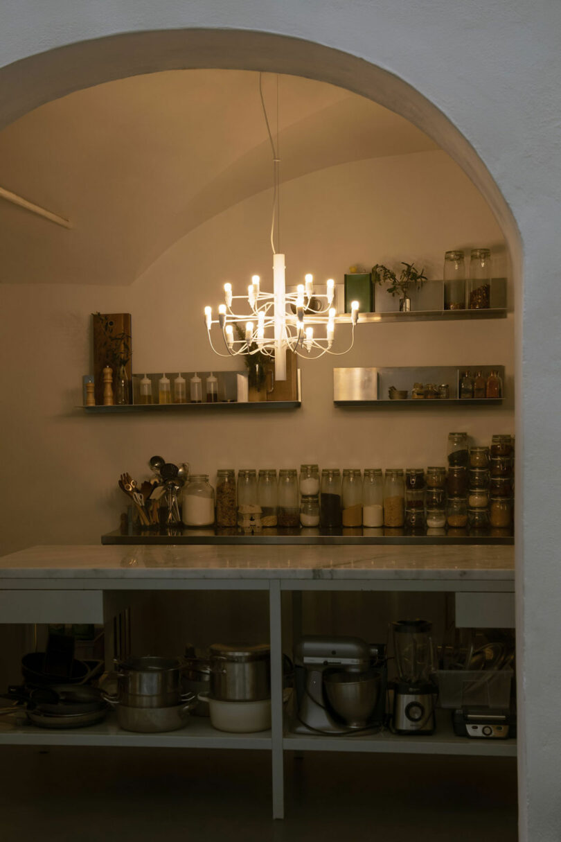 minimalist white chandelier in a kitchen