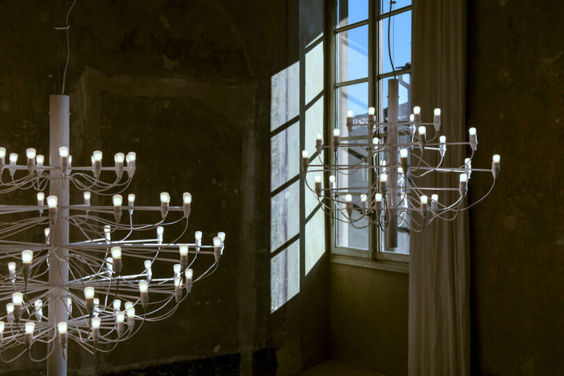 minimalist white chandeliers in an empty room