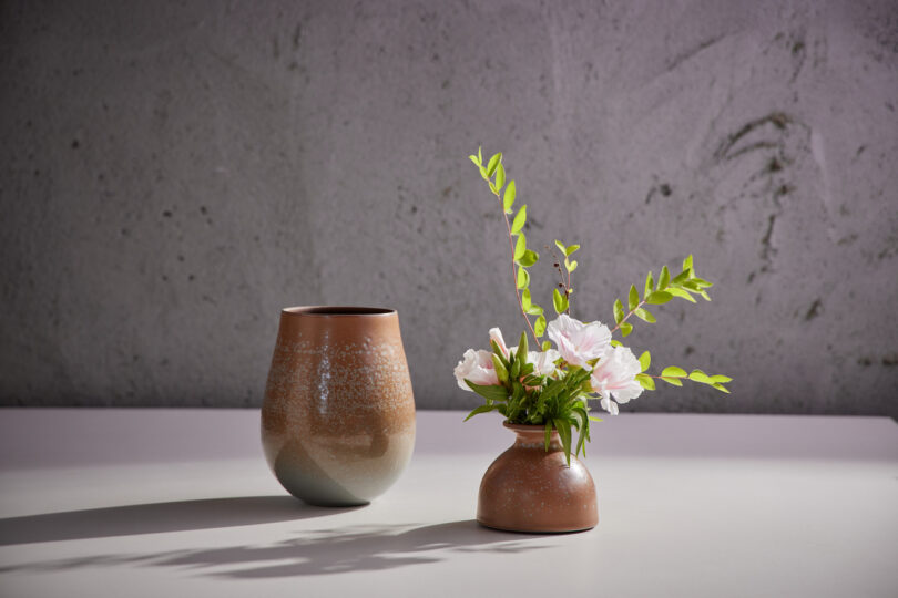 vase with white flowers and greenery
