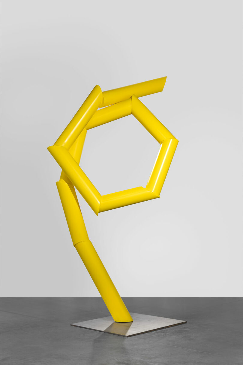 gallery view of yellow sculpture of angular knot