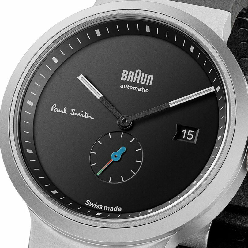 closeup face view of black watch with silver casing