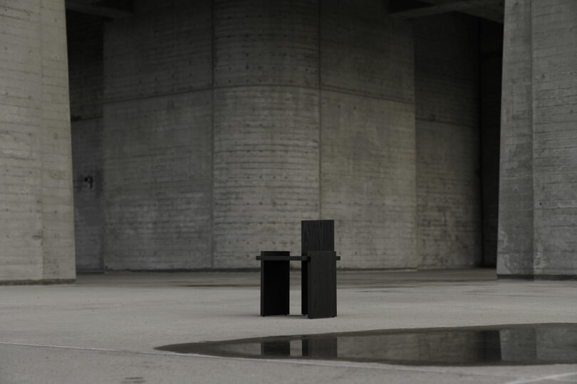 Black chair in an open concrete space