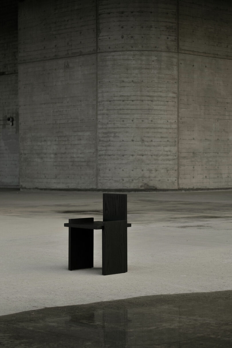 Black chairs in an open concrete space