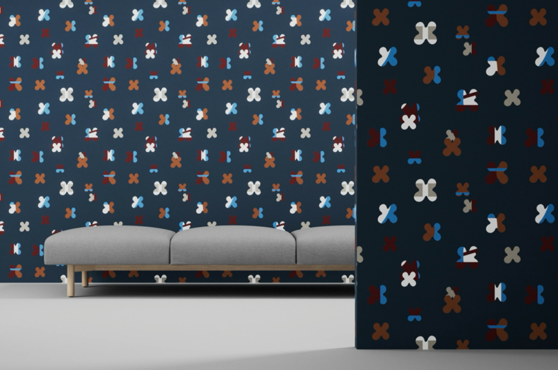 geometric patterned wallpaper in a styled space