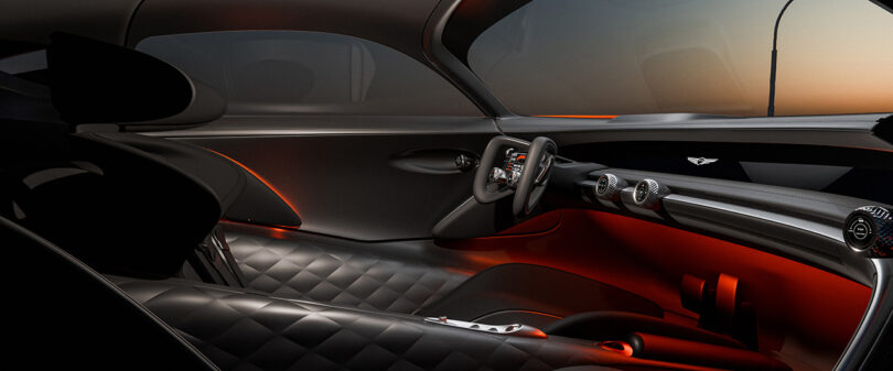 Interior driver side of the Genesis X Gran Berlinetta Vision Gran Turismo Concept with yolk steering wheel, quilt padded interior and carbon fiber detailing