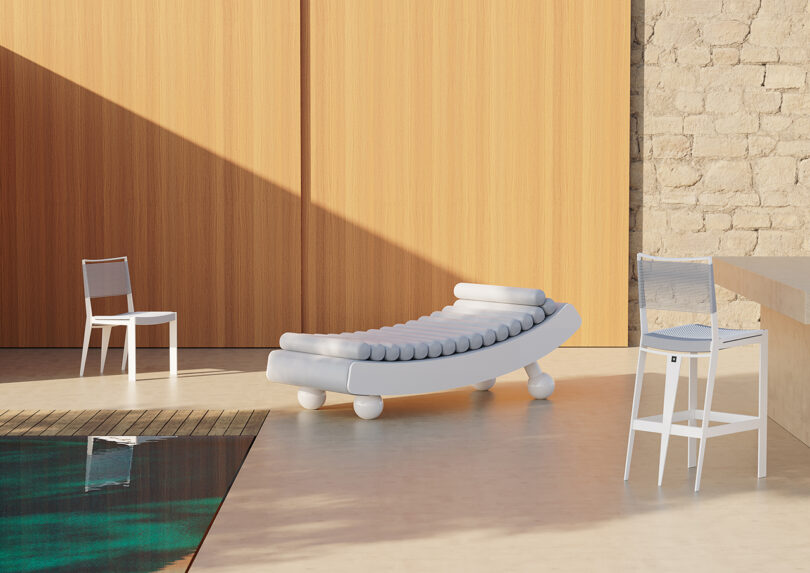 dining chair, daybed, and bar chair by a pool