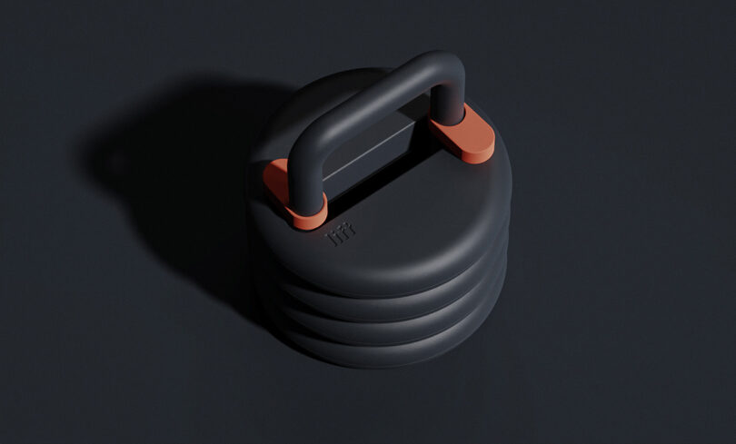 Angled top view of Lift stackable weight kettlebell in black with orange lock mechanism details.