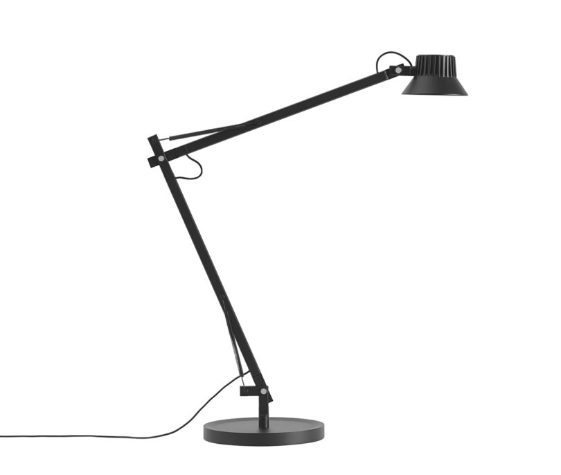 Black base desk lamp with spring arm and small LED light.