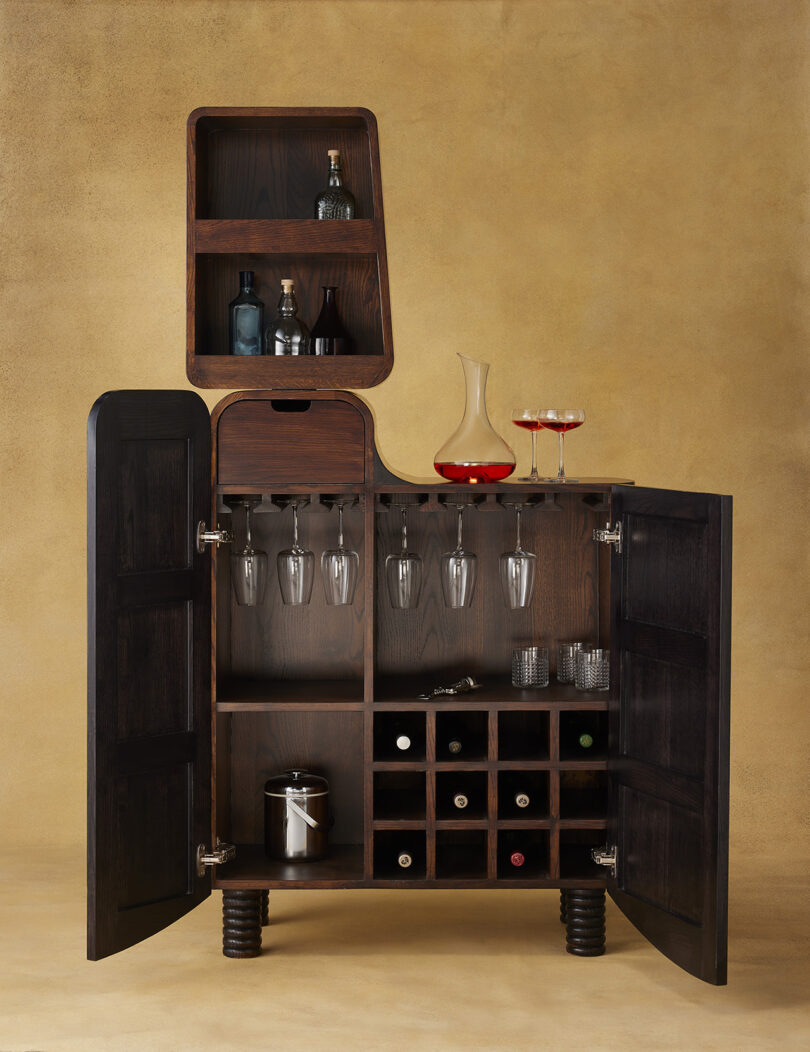 open dark wood stocked bar cabinet