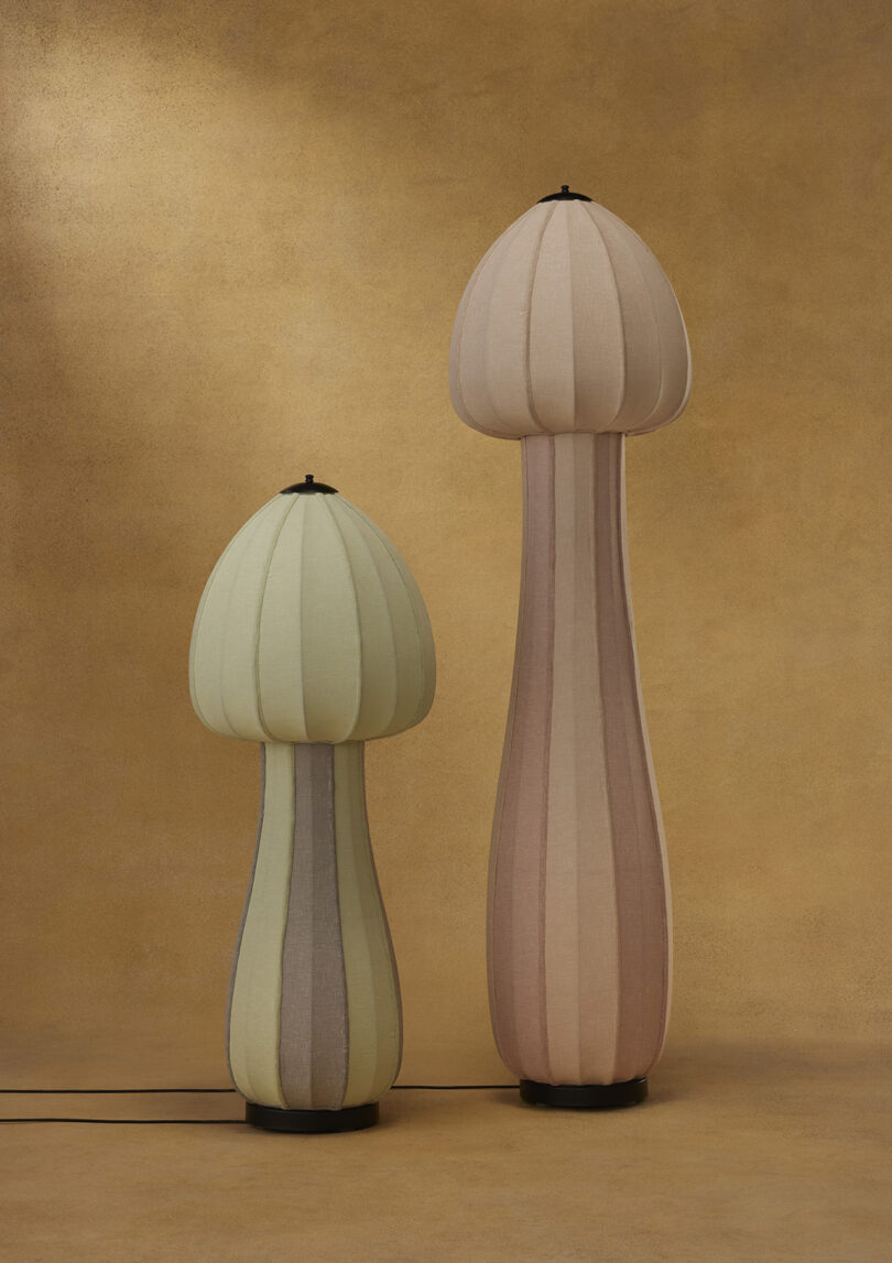 two tall mushroom-shaped floor lamps