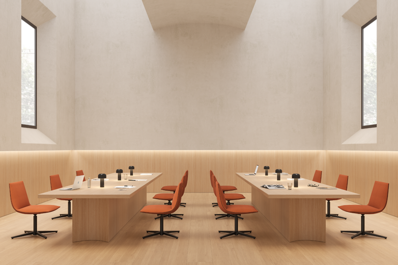 room with two large conference tables surrounded by chairs
