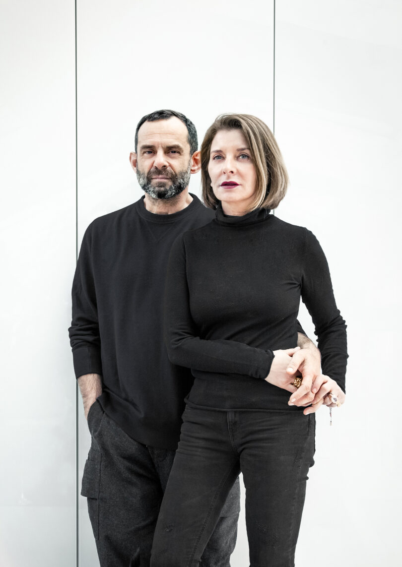 light-skinned man and woman dressed in all black