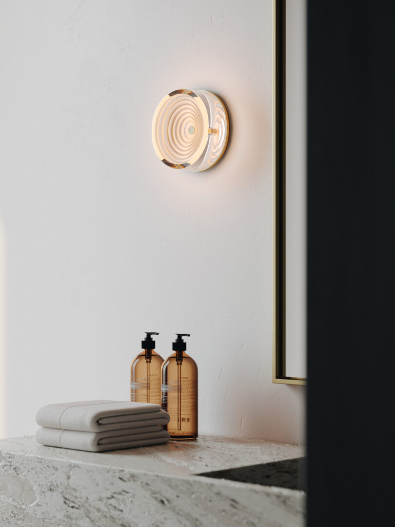 circular wall sconce in a styled interior space