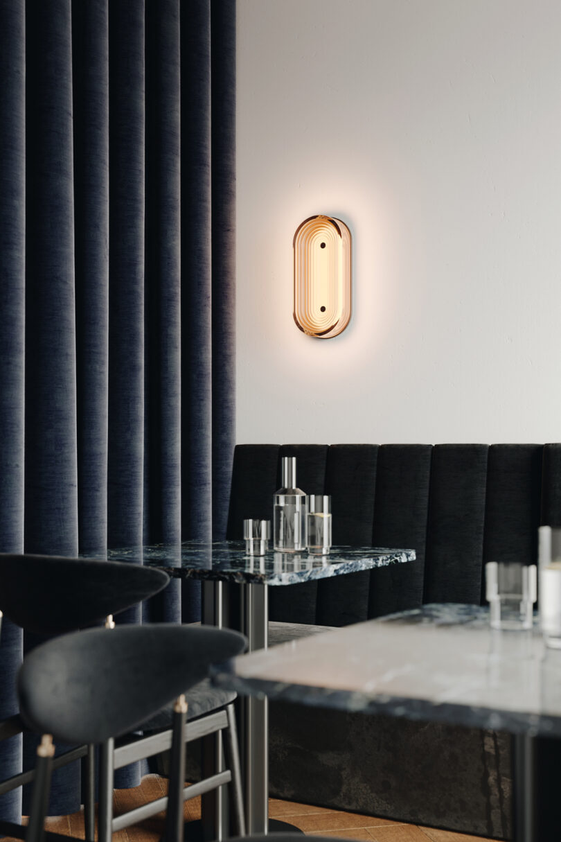 ovular wall sconce in a styled interior space