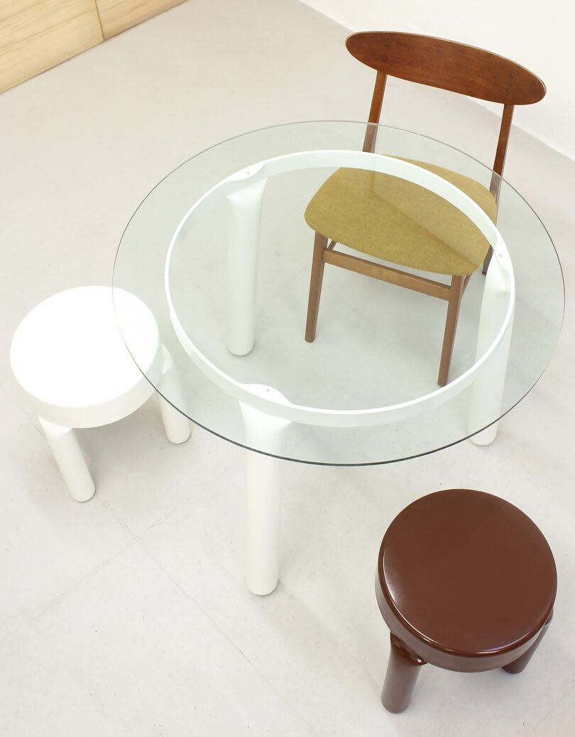 round table with two stools and a dining chair