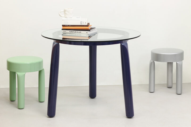 two low stools with round table