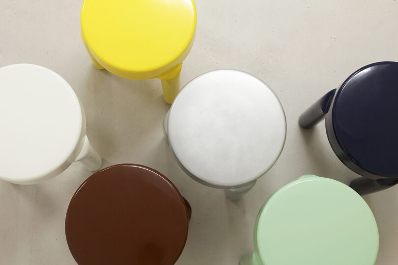 overhead image of six stools of various colors