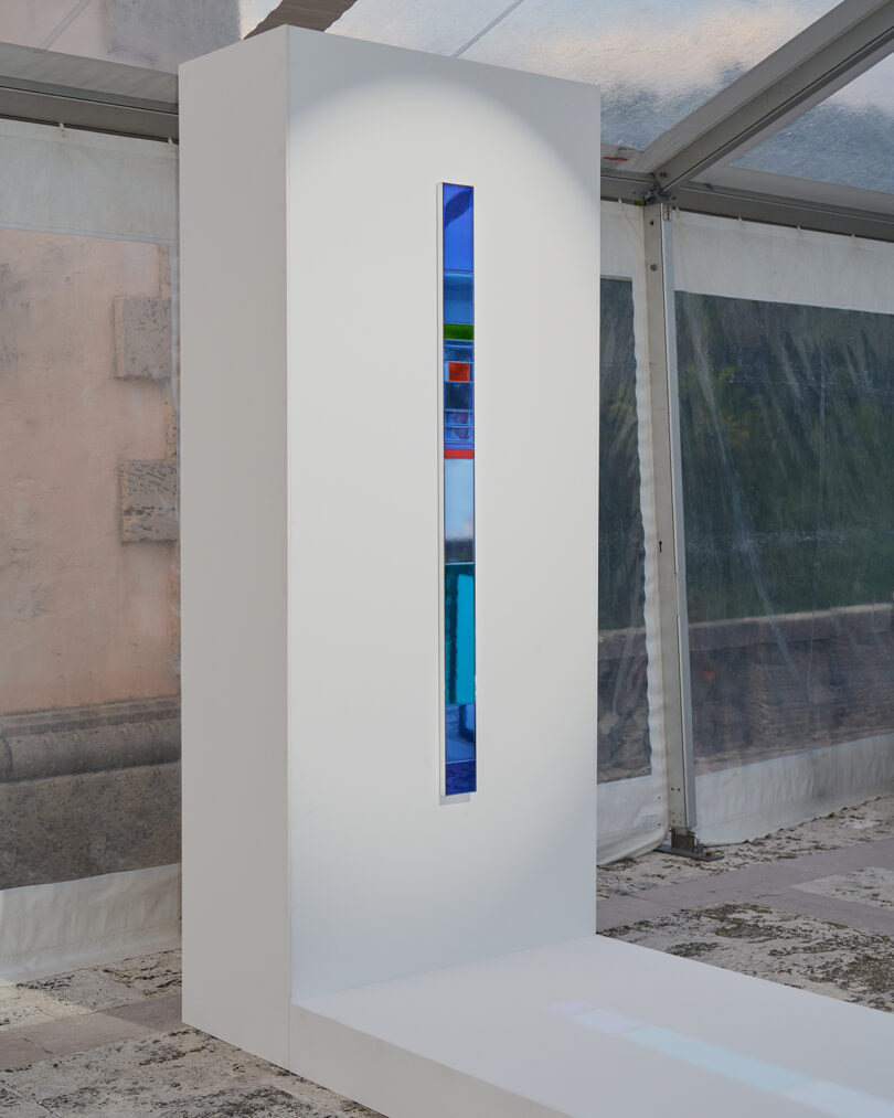 long vertical bar with pieces of blue mirror