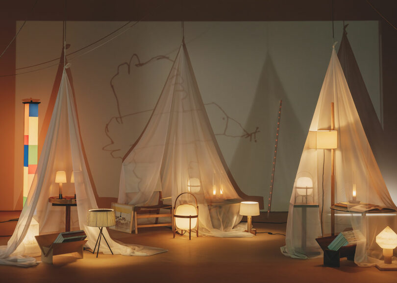 A series of tents staged with lighting and home accessories.