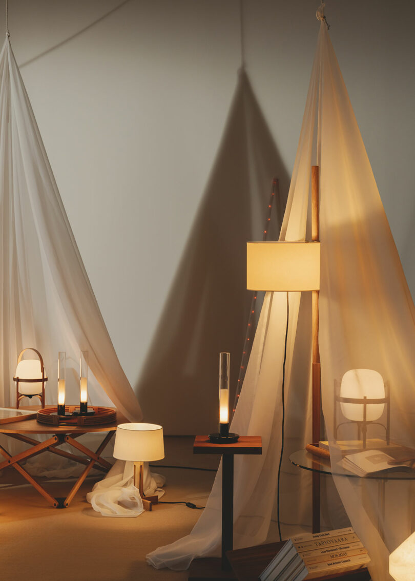 Floor lamps and tables staged in tents