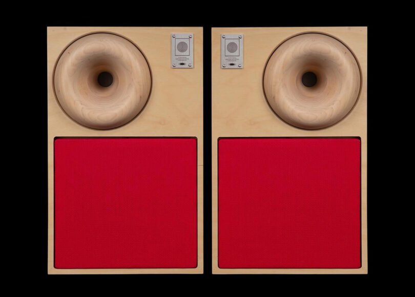 Western Acoustics Type 2 bookshelf speakers with blonde wood cabinet construction and red acoustic speaker cloth grilles.