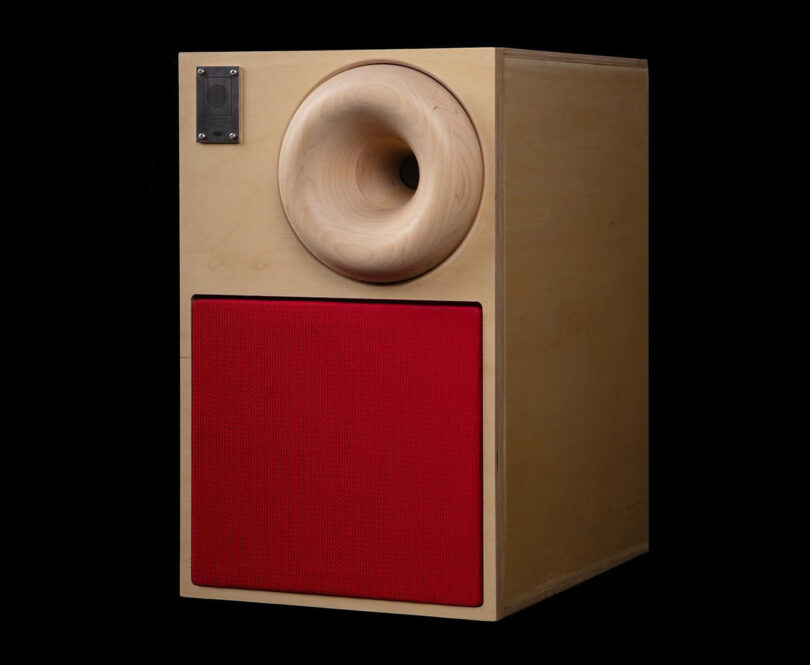 Western Acoustics Type 2 bookshelf speaker with blonde wood cabinet construction and red acoustic speaker cloth grille.