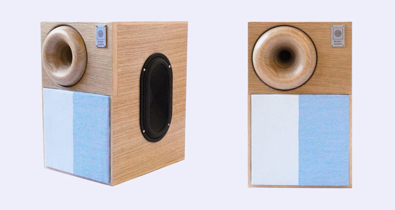 A pair of Western Acoustics Type 2 bookshelf speakers with a 2-tone speaker fabric grille in light blue hues.
