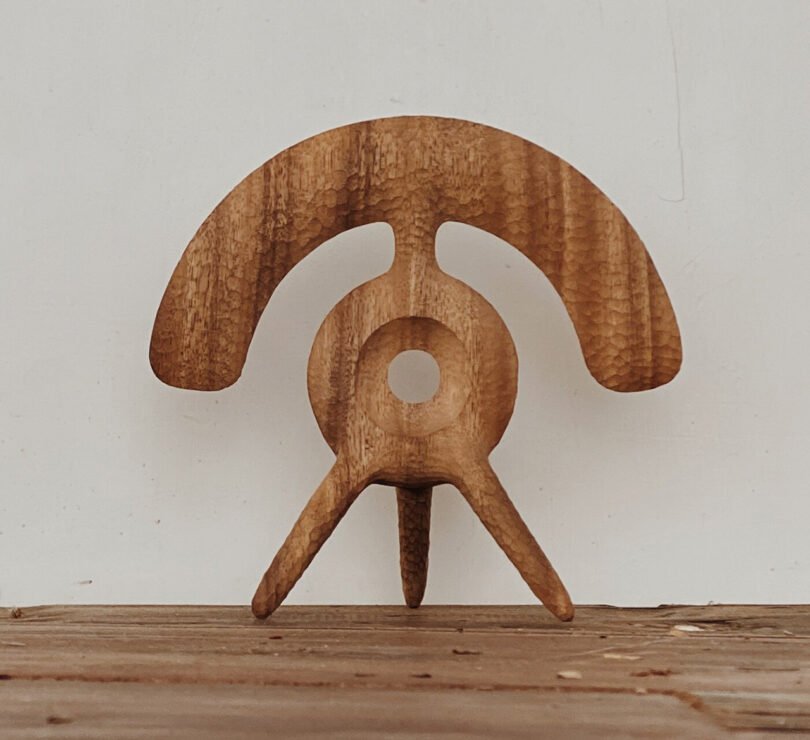 Carved wood sculpture by Aleph Geddis, opinionated upon 3 limb guidelines and ample arching top.
