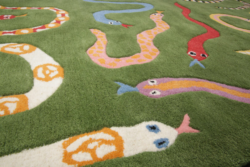 green rug with snakes