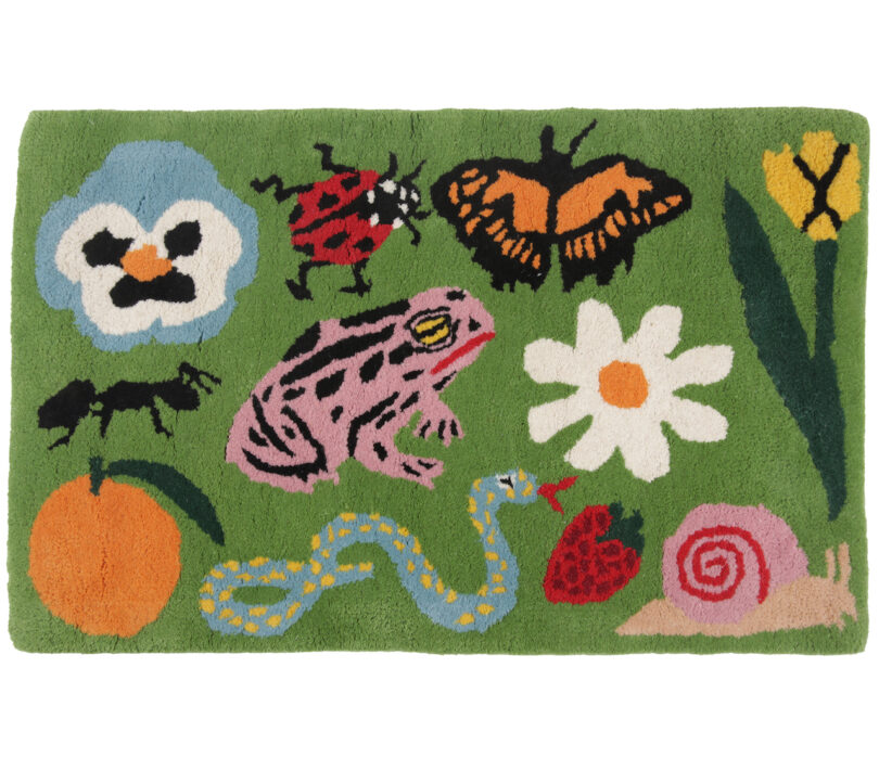 green rug with garden motifs