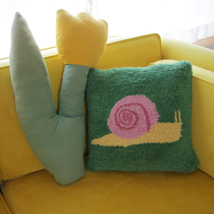 snail pillow on yellow chair