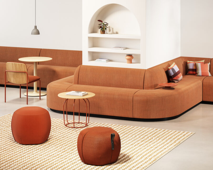 orange banquette seating around wall with built-in shelving
