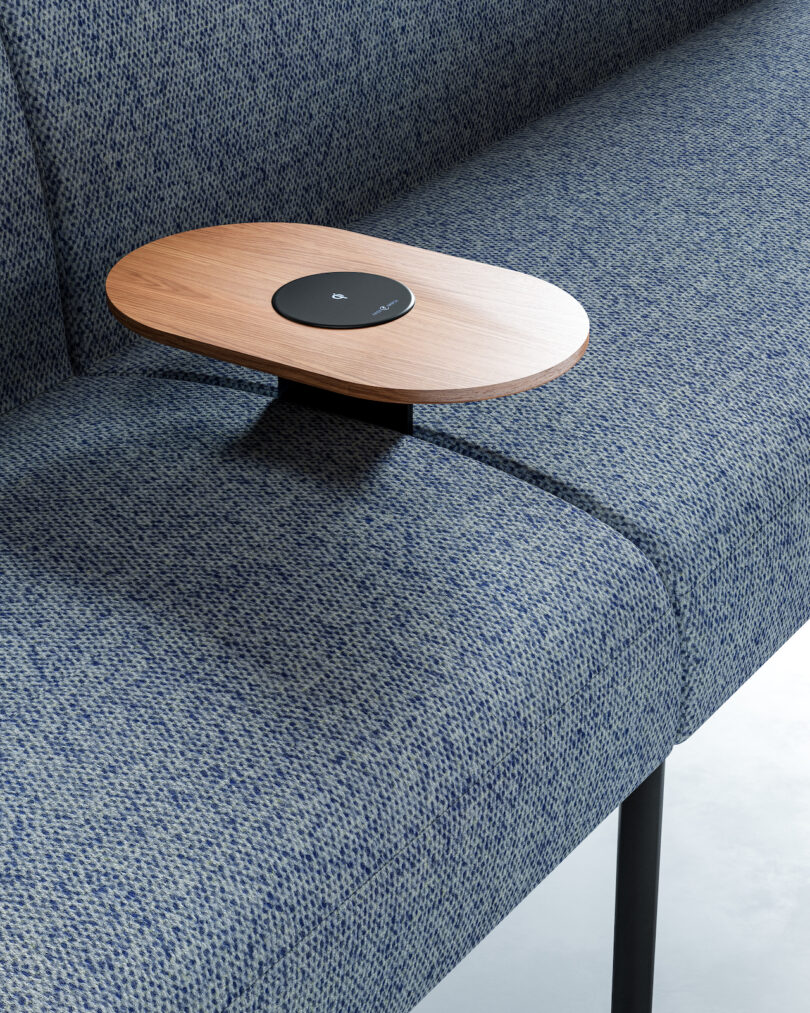 wireless charging tray on blue seating