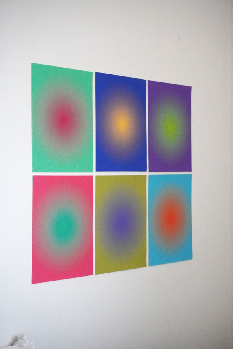 wall grid of framed gradient prints