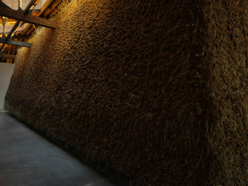 Artist Delcy Morelos' "El abrazo" envelops a wood rafter