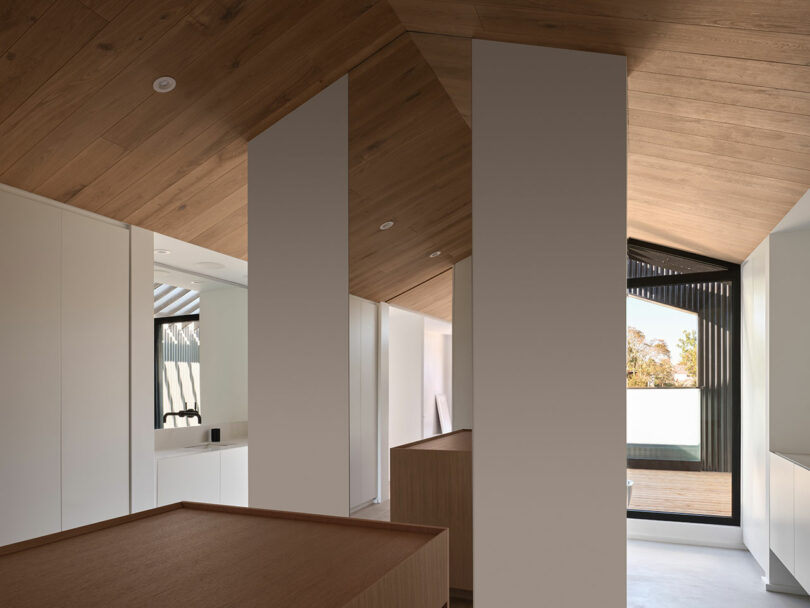 view through partially open floor in modern house that shows view from open close to bathroom