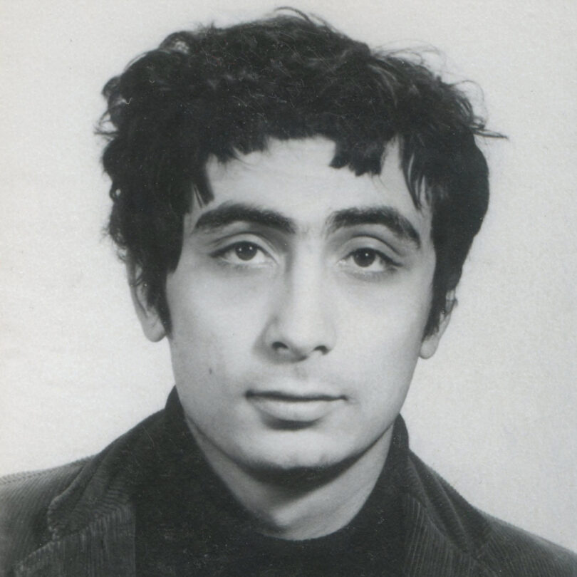 black and achromatic image of a man pinch achromatic ruffled hair
