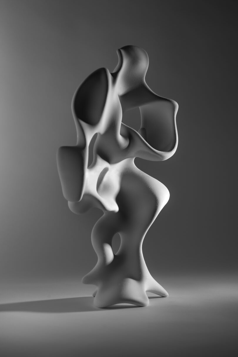 abstract achromatic sculpture connected a pedestal