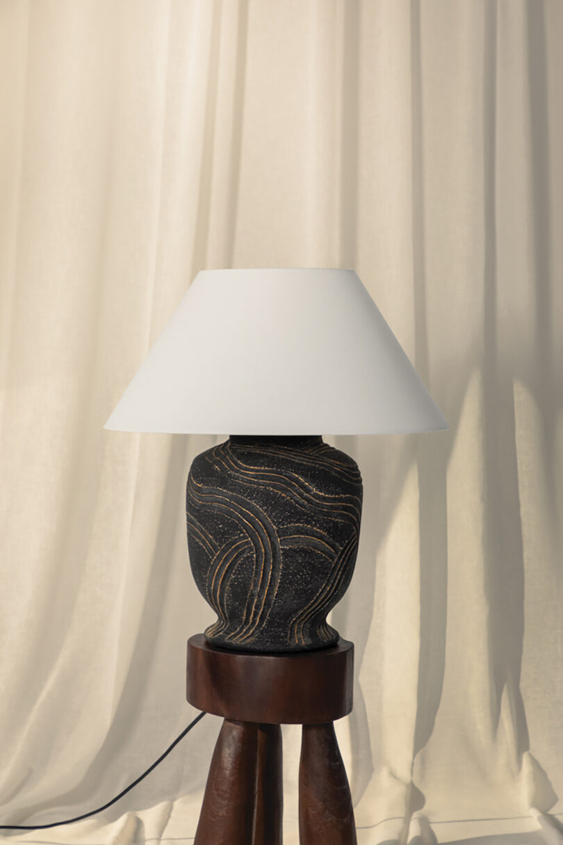 table lamp with a large black base and white shade