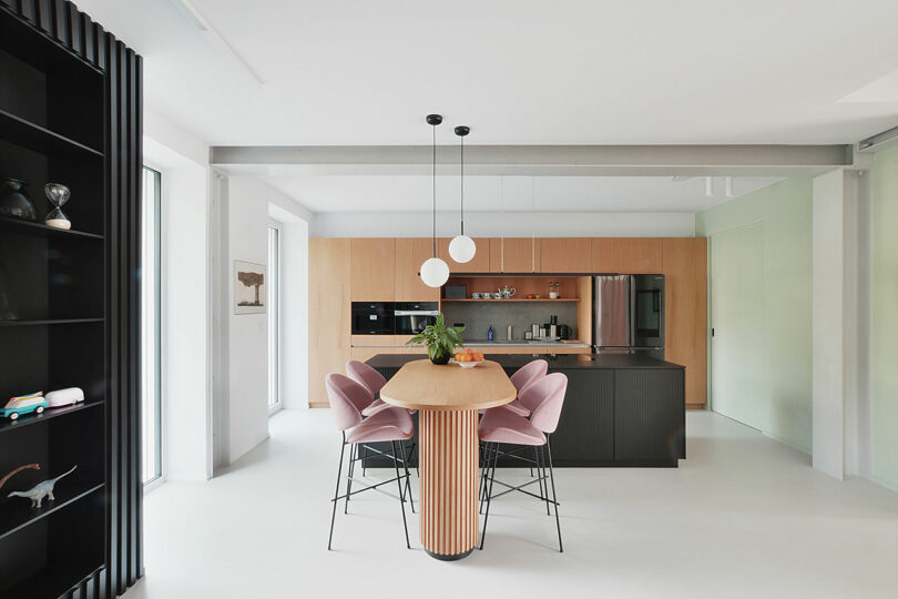 interior position into modern room pinch wood cabinets, achromatic island, and wood barroom array pinch pinkish stools