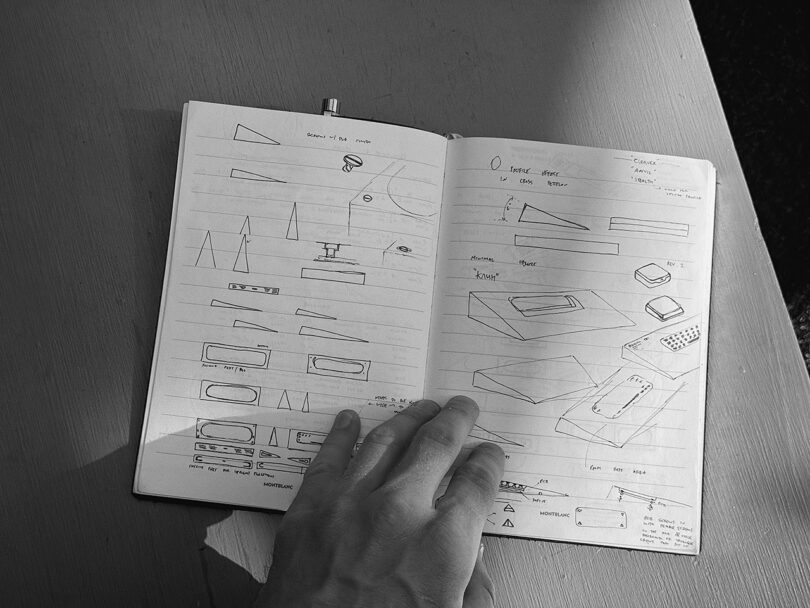 Denis Agarkov's notebook with sketches of the IceBreaker keyboard across a spread of pages.