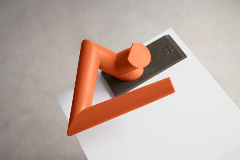 orange angular faucet connected achromatic surface