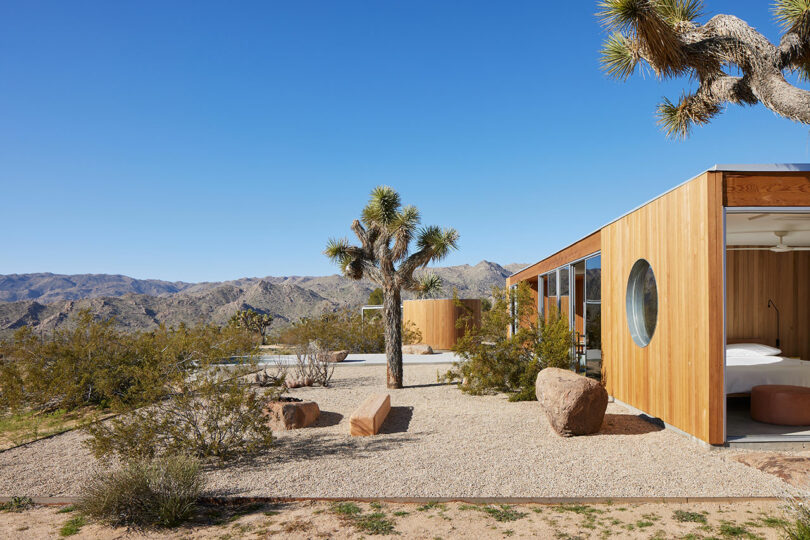 end exterior view of modern wood pavilion style house in desert